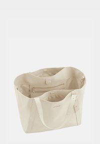 Beige schoudertas gemaakt van gestructureerd faux leather. Wijde opening, dubbele handvatten, binnenzak met rits en een gladde, gevoerde binnenkant.