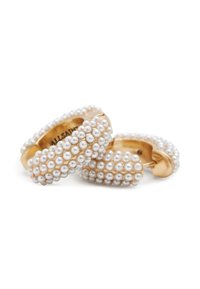 Gold hoop earrings adorned with clusters of small white pearls, featuring a smooth surface and rounded edges, creating a textured appearance.