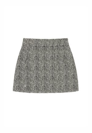 Houndstooth-gestreepte rok in zwart en wit. Heeft een aansluitende taille en een uitlopende silhouet. Gemaakt van een textuurstof.