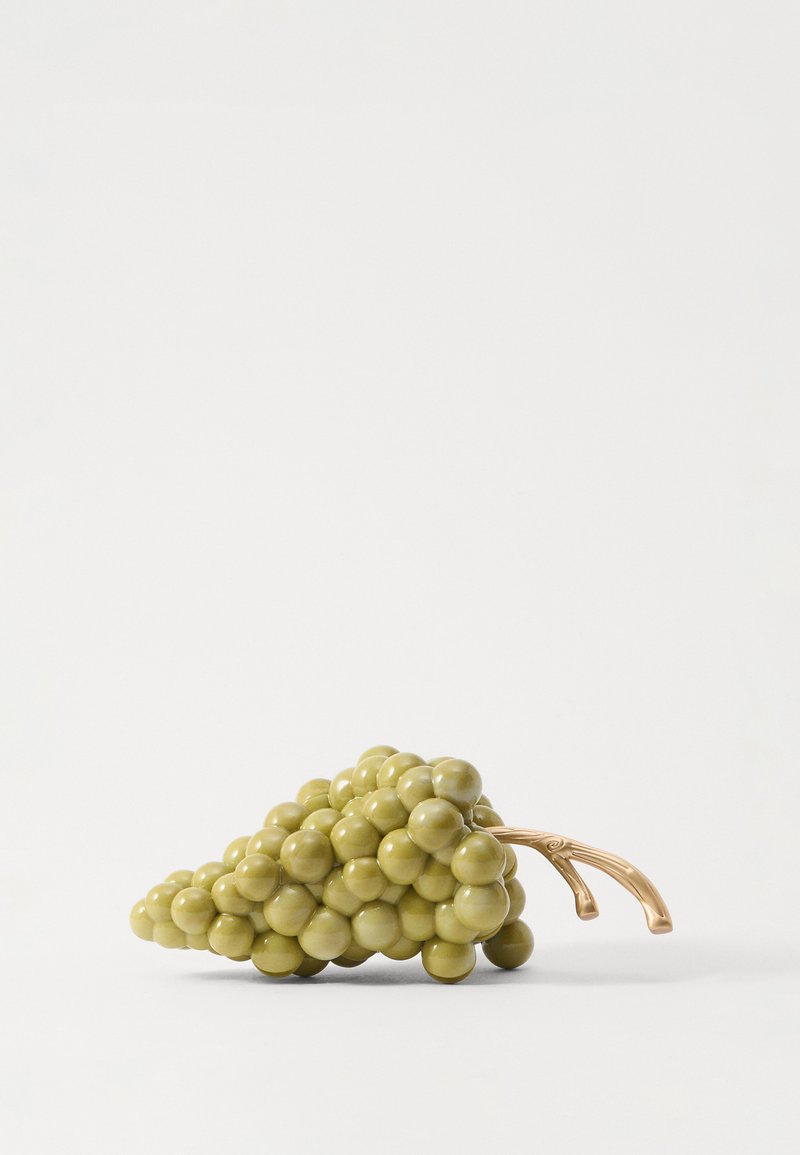 Green grape cluster sculpture with glossy finish, round beads, and a bronze stem. Simple, smooth design against a white background.