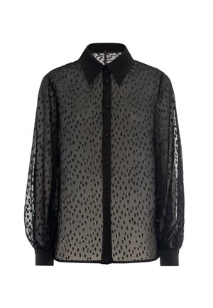 Black sheer blouse with polka dot pattern, button front, and structured collar; features elasticized cuffs and solid black accents.