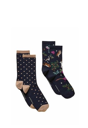 Deux paires de chaussettes bleu marine, une avec des pois marron clair et des talons, l'autre avec des motifs colorés d'animaux et de fleurs.