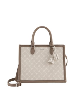 Beige tote bag with a light patterned surface, brown accents, dual handles, and a detachable shoulder strap. Features tassels on the side.