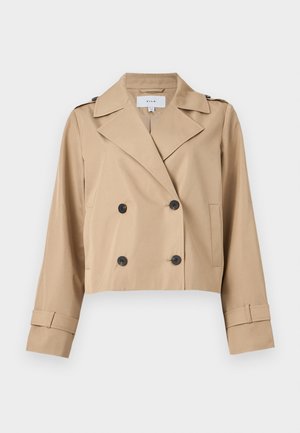 Beige, kurz geschnittene, doppelreihige Jacke mit breiten Revers, schwarzen Knöpfen, Schulterklappen und Manschettenriemen.