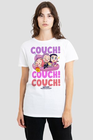 Young woman wearing a white t-shirt with cartoon characters lounging on a pink couch and text "COUCH! COUCH! COUCH!" in purple and red.