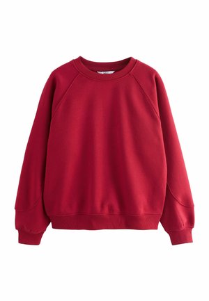 Red sweatshirt with a crew neckline, raglan sleeves, and ribbed cuffs. Soft, textured fabric with a relaxed fit. No patterns or accents.