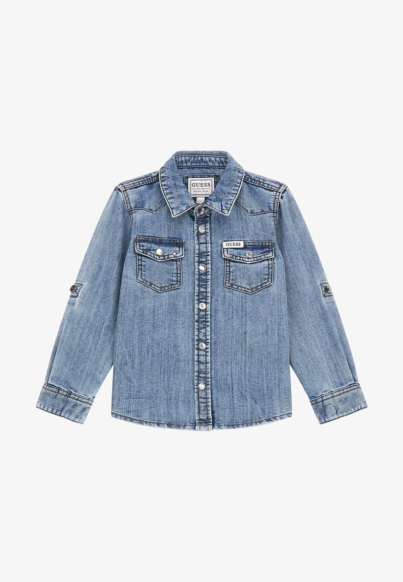 Veste en denim bleu clair avec fermeture boutonnée sur le devant, deux poches poitrine et col classique. Caractérisée par des coutures contrastées et des poignets réglables.