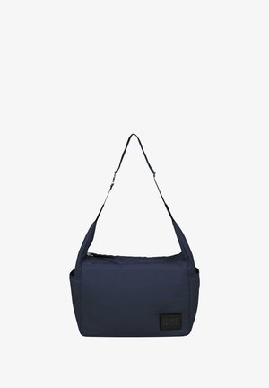 Navyblauwe schoudertas van zachte, duurzame stof met een ritssluiting, voorzien van een voorvak en logo patch. Verstelbare schouderband voor extra comfort.