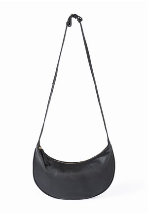 Black crescent-shaped leather shoulder bag with a long adjustable strap and top zipper closure.