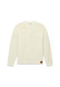 Cremefarbener Strickpullover mit strukturiertem Muster, rundem Ausschnitt, überschnittenen Schultern und einem braunen Lederetikett an der unteren Seite.