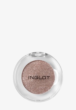Boîte ronde d'ombre à paupières pailletée rose doré Inglot avec couvercle en plastique transparent sur fond clair.
