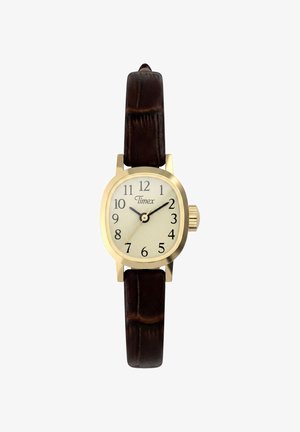Montre-bracelet Timex en or avec cadran crème, chiffres noirs et bracelet en cuir marron foncé affichant l'heure 10:09:34.