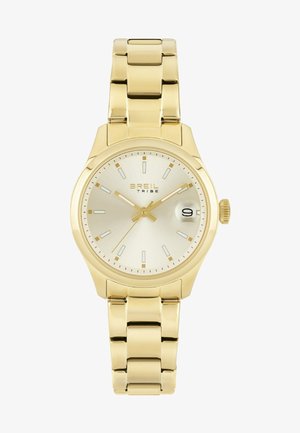 Montre-bracelet en métal doré avec un cadran rond, un cadran argenté, des index horaires et un affichage de la date. Présente un bracelet à maillons et une couronne sur le côté.