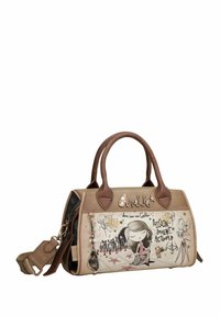 Sac à main beige avec des accents en cuir marron, présentant des illustrations artistiques, des étoiles et une sangle amovible. Surface texturée avec des détails uniques.