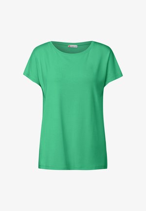 Groene t-shirt met korte mouwen van zachte stof, met een ronde halslijn en een ontspannen pasvorm. Eenvoudig ontwerp; geen zichtbare patronen of accenten.