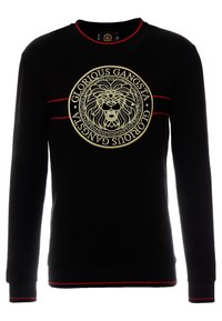 Sudadera negra con detalles rojos, con un gráfico circular de un león y el texto "Glorious Gangsta". Hecha de una tela suave con mangas largas.