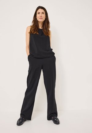 Black sleeveless blouse with a gathered neckline, paired with loose-fitting black pants. Smooth, lightweight fabric with overall relaxed silhouette.