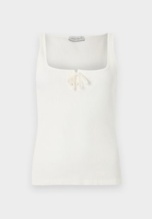 Débardeur blanc côtelé sans manches avec un décolleté carré et un petit nœud noué au centre devant.
