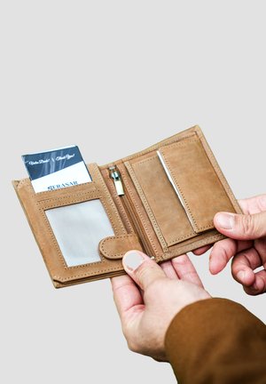 Brown leather wallet with zippered compartment, card slots, and a transparent ID window. Soft texture and minimalist design.