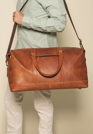 RUBEN - Weekend bag - rotbraun