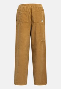 Brown corduroy pants with a relaxed fit, featuring a wide leg, elastic waistband, and two back pockets. Texture is ribbed and soft.