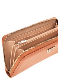 Tan leather wallet with a textured trim, zip closure, multiple card slots, and a silver-toned zipper pull detailing.