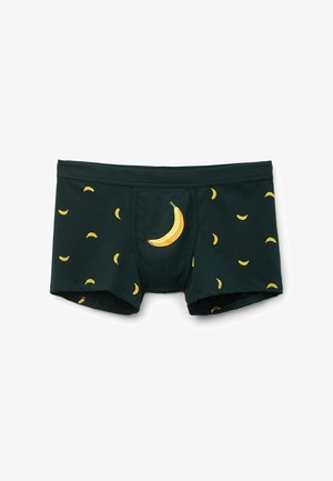 Boxer shorts verde scuro realizzati in morbido tessuto, decorati con motivi di banane gialle, tra cui un design di banana più grande sul davanti.