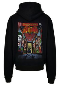 Felpa nera con cappuccio, caratterizzata da una grafica colorata in stile fumetto di Batman, con villain illustrati all'interno di riquadri e testo in grassetto. Materiale in cotone, design a pullover.