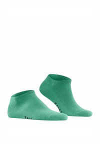 Grüne Knöchelsocken aus weichem Material mit geripptem Bündchen und glatter Textur. Mit schwarzem Logo an der Seite für Branding.