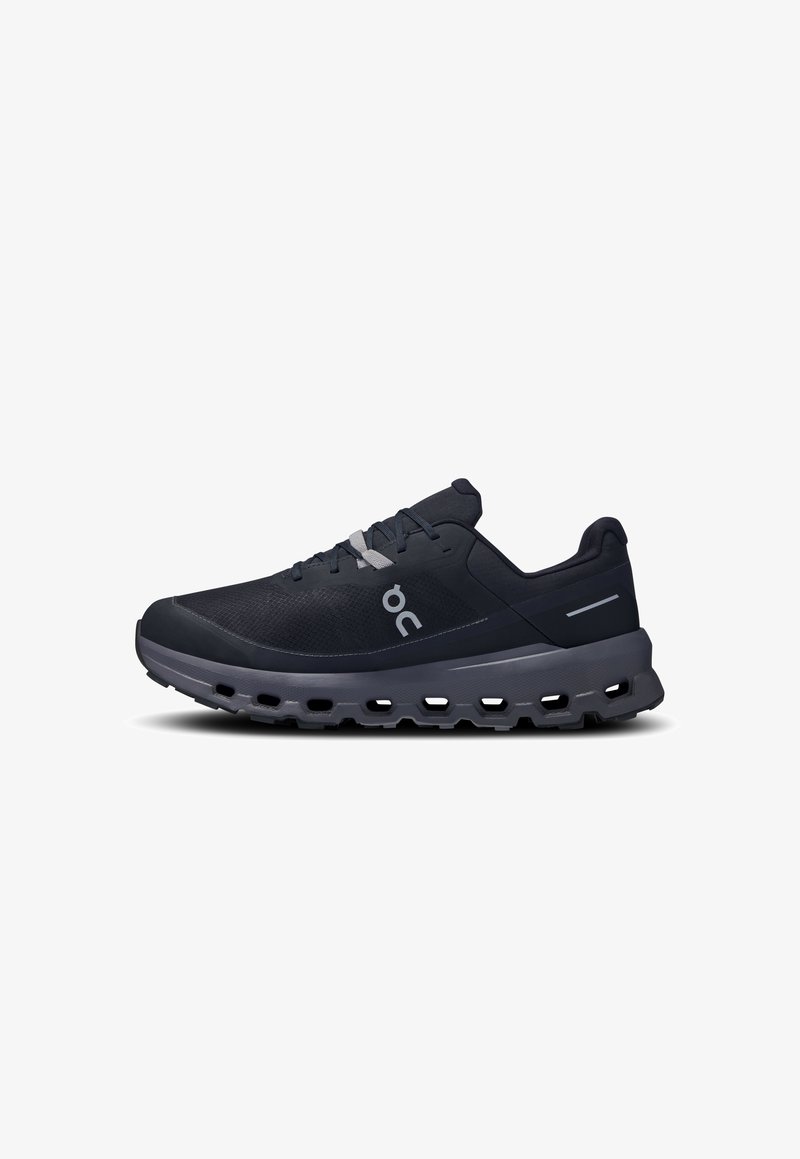 Black athletic shoe with a breathable mesh upper, grey accents, cushion sole with cutouts, and a rounded toe for enhanced comfort.
