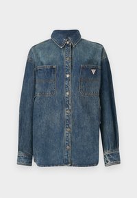 Denimjakke med knappestolpe foran, to brystlommer og spiss krage. Har en falmet blå farge og metallsnapper.