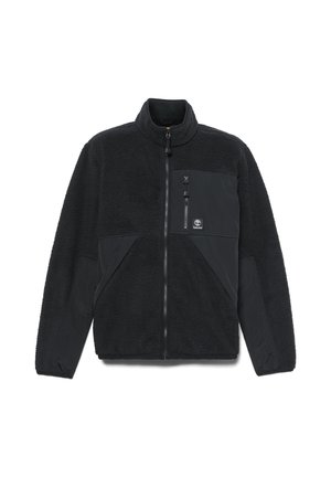 Zwarte fleece jas met een ritssluiting bij de kraag, twee voorzakken en een borstzak. Gelaagde stof met gladde accenten. Timberland-logo op de zak.
