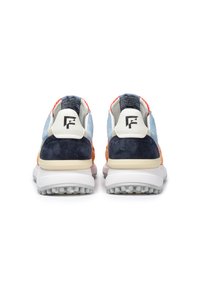 Multicolored sneakers featuring a mix of suede and mesh materials. Design includes a white heel counter and visible cushioning in the sole.