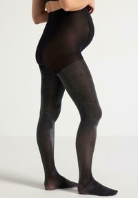 Sorte strømpebukser med høj talje, der har en glitrende tekstur og en gradient-effekt fra uigennemsigtig til gennemsigtig. Glat finish hele vejen igennem.