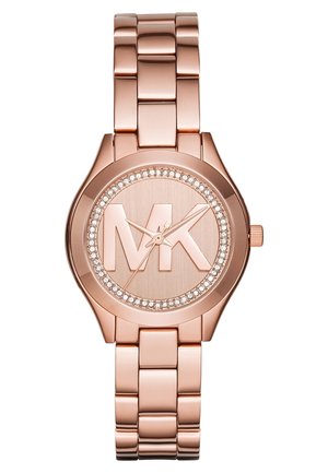 Montre-bracelet en métal or rose avec grand logo MK sur le cadran, lunette en cristal et bracelet à maillons.