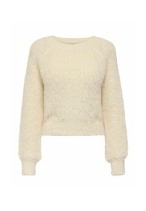 Īsa džempera stila džemperis mīkstā, pūkainā krēmkrāsas materiālā ar garām piedurknēm, ribotām aprocēm un apaļu kakla izgriezumu. Nav redzamu rakstu vai akcentu.