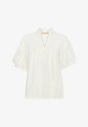 Valge pluus lühikeste, laienevate varrukatega, V-kaelusega, tekstureeritud kangast ja vertikaalsete triipudega. Fookuseks on dekoratiivne ääris allääres.