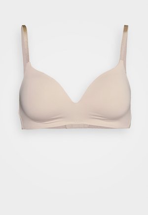 Light beige bra with a smooth, padded plunge design. Adjustable straps in a lighter shade, featuring subtle textured accents.