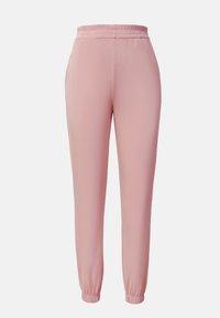 Pantalons de jogging roses avec une taille élastique, des poignets fuselés et une texture lisse. Tissu léger adapté pour un usage décontracté.