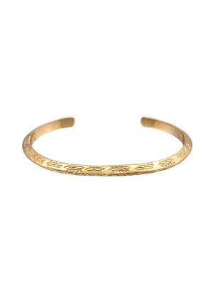 Gold cuff bracelet featuring a textured design with intricate patterns and smooth, polished edges. Open-ended for adjustable fit.