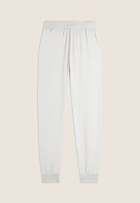 Lichtgrijze joggingsbroek van zacht materiaal, met een elastische tailleband en boorden, een gladde textuur en een taps toelopend ontwerp.