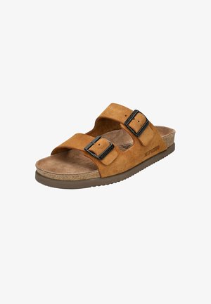 Sandale mule en daim marron avec deux boucles en métal noir réglables et une semelle intérieure en liège moulée, portant l'inscription "Mephisto" sur le côté.