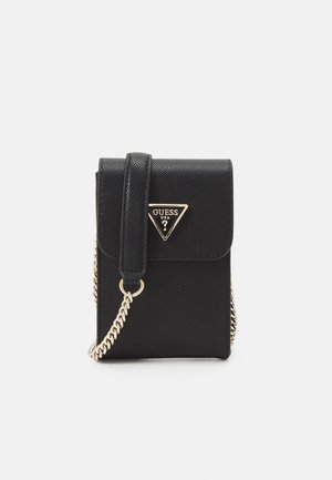 Black textured crossbody bag with gold chain strap and triangular Guess USA logo on front flap closure.
