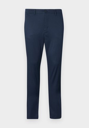 Tumedast sinine chinos, valminud siledast kangast, millel on nööbiga sulgemine, eespooltaskud ja kohandatud, kitsas lõige.