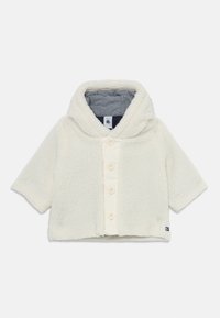Hele kreemikas fliisk Jacket kapuutsi, lühikeste varrukatega ja nööpide ees. Siseosa on triibulise kangaga ja brändi silt.
