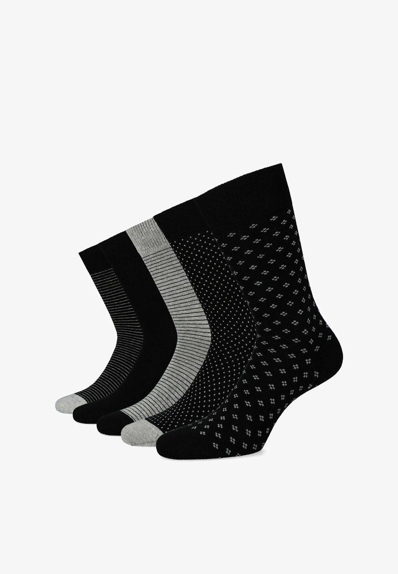 Cztery pary skarpetek w kolorach czarnym i szarym. Cechy obejmują jednolite, w paski i w kropki wzory; różne tekstury; oraz kontrastowe kolory palców.