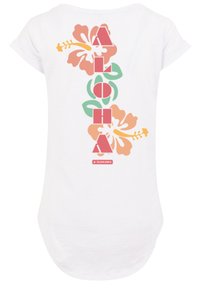 White t-shirt featuring a vertical "ALOHA" text design with floral accents in pink and green hues, made from soft cotton material.