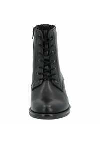 Stivale alla caviglia in pelle nera con lacci anteriori e zip laterale. Texture liscia, punta arrotondata e design minimalista. Adatto per varie occasioni.