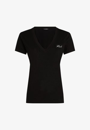 Črna majica s kratkimi rokavi in V-izrezom, izdelana iz mehkega materiala, z belim izvezenim logotipom na prsih. Preprost in prilega se zasnovi.