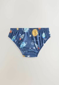 Sous-vêtements bleus pour tout-petit avec un motif coloré du système solaire, comprenant le soleil, les planètes, les étoiles, des fusées et des corps célestes étiquetés.